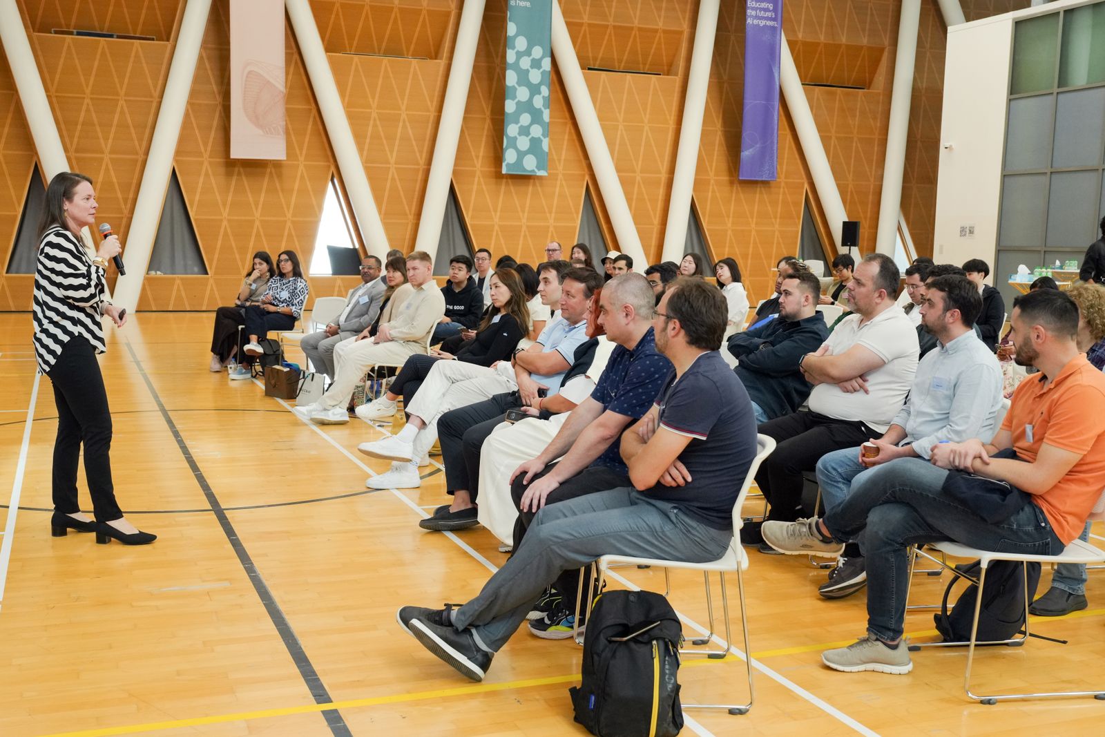 An audience listening to a speaker at a company town hall